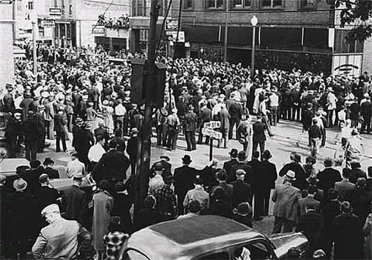 Crowd outside of meeting at Teamsters Local 544 at the corner of Third Street North and Plymouth North, Minneapolis (circa 1936).