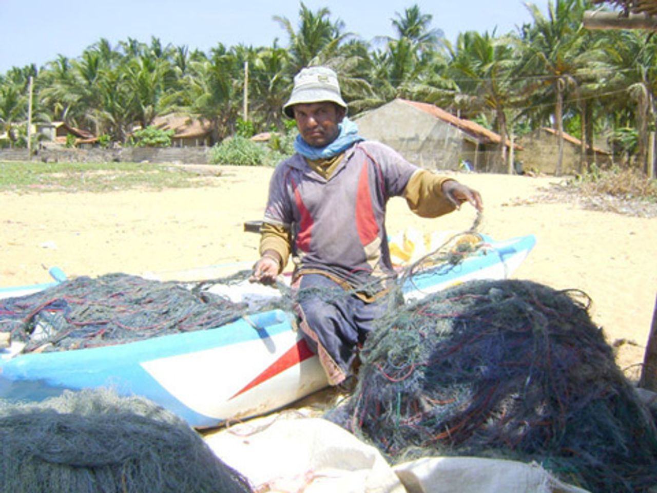 A fisherman preparing his nets A fisherman preparing his nets