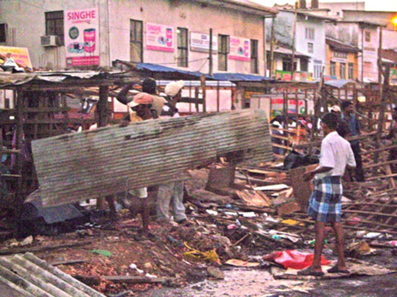 Colombo hawkers after police destroyed their makeshift stalls Colombo hawkers after police destroyed their makeshift stalls
