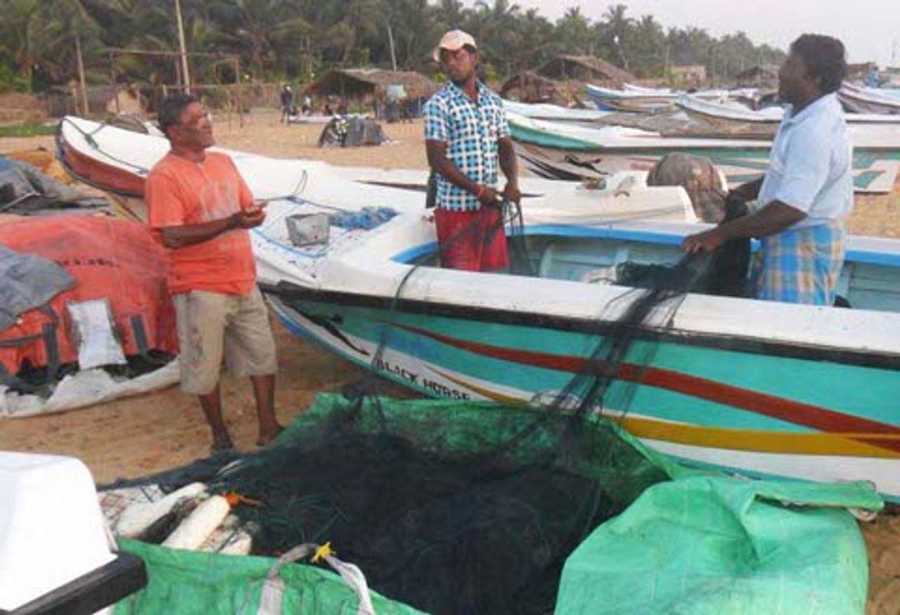 Fishermen preparing to go to sea Fishermen preparing to go to sea