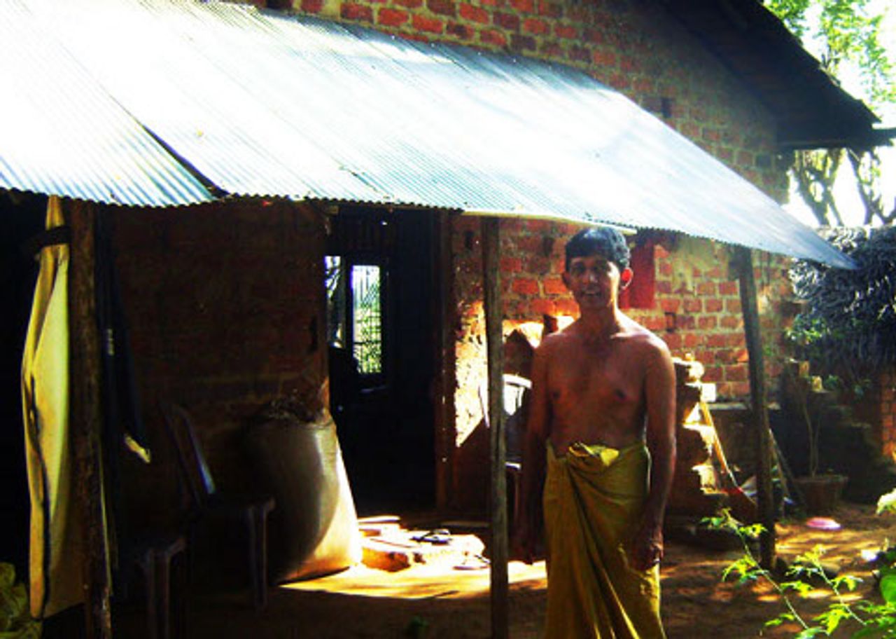 R.B Dharmathilaka outside his half-built home R.B Dharmathilaka outside his half-built home
